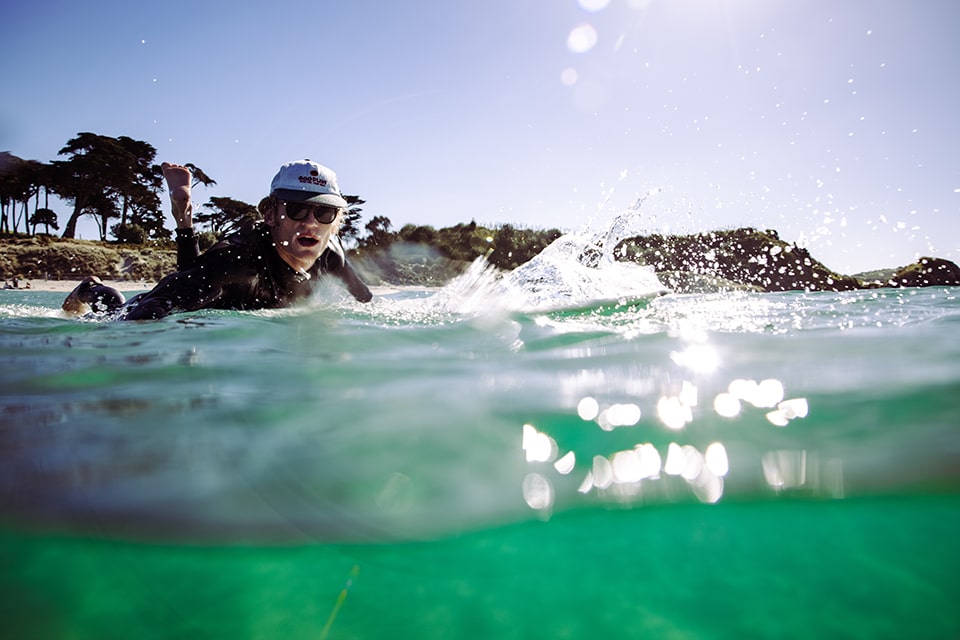 Man surfing in the USA wearing Vilo Wood Sunglasses